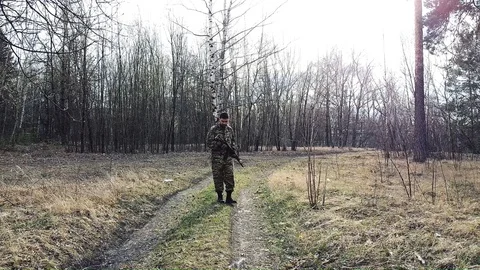 A military young man is guarding and patrolling the territory Stock Footage