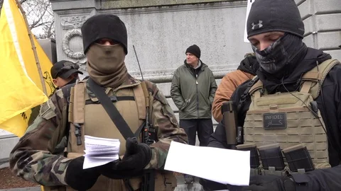 Militiamen protesting COVID-19 rules Stock Footage 128664793