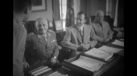 Militry officers talking to a soldier while at meeting Stock Footage 37594484