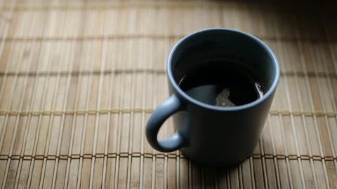 Milk is added to coffee Stock Footage 132922692