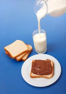 Milk and bread with chocolate Stock Photos