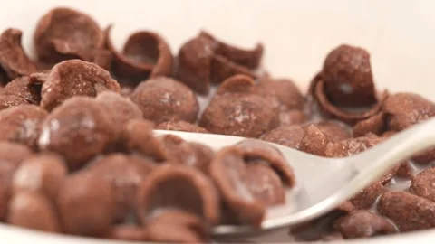 Milk and Cornflakes in a macro slow motion shot Stock Footage 249905663