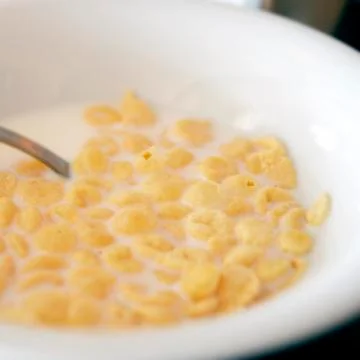 Milk and cornflakes Stock Photos