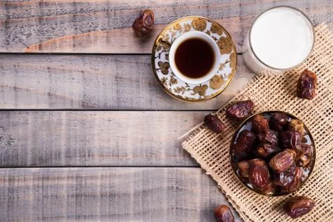 Milk and dates fruit. Muslim simple Iftar concept. Ramadan food and drinks. Stock Photos
