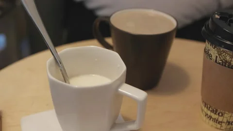 Milk and latte on the table 스톡 동영상 162234579