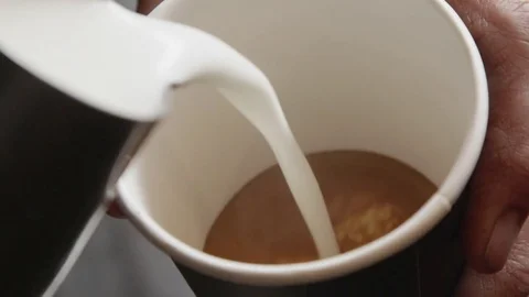 Milk Being Added to Coffee Stock Footage 82677053