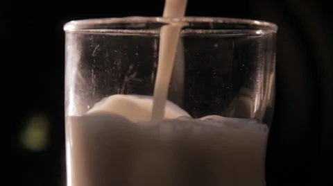 Milk being Poured with black background Video stock 34206568