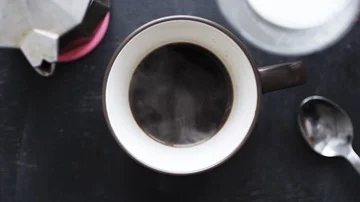 Milk being poured into coffee Stock-Footage 86015046