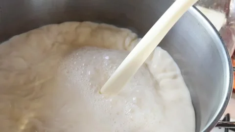 Milk being poured into a pot Stock Footage 322811587