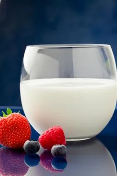 Milk with berries Stock Photos