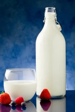 Milk with berries Stock Photos