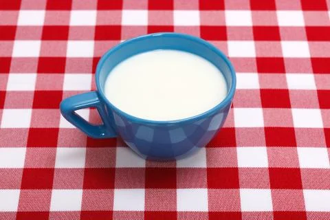 Milk in blue cup Stock Photos