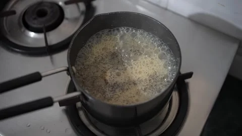 Milk Boiling On Gas With Tea Powder And Suger While Tea Making Stock Footage 246594902