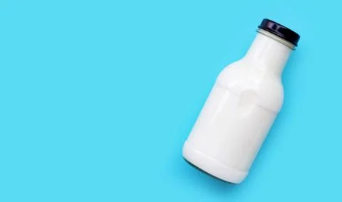 Milk bottle on blue background. Foto stock