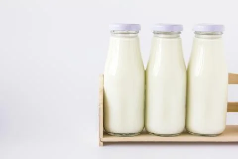Milk bottle in the box Stock Photos