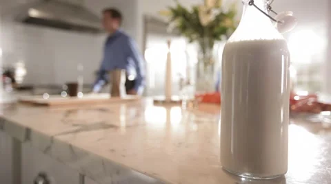 Milk bottle on a counter Video stock 40041787