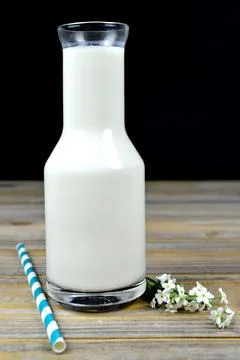 Milk bottle on the table Stock Photos