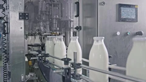 Milk bottling plant processing fresh milk into glass bottles on industrial Stock Illustration