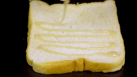 Milk on bread Stock Footage 320751802