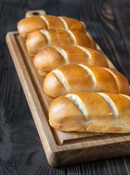 Milk bread rolls on the cutting board Stock Photos