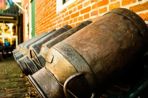 Milk cans in a row Stock Photos