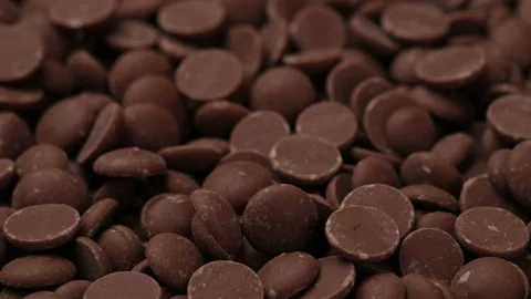 Milk chocolate chips close up rotation. confectionery concept Stock-Footage 148156236