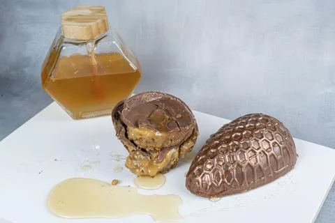 Milk chocolate Easter egg filled with Brazilian honey cake 16. Stock Photos