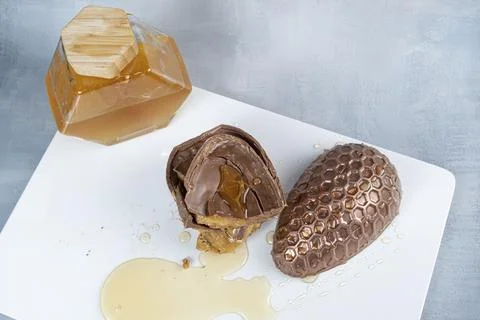 Milk chocolate Easter egg filled with Brazilian honey cake 19. Stock Photos