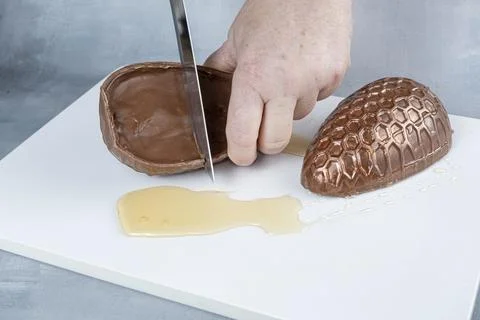 Milk chocolate Easter egg filled with Brazilian honey cake 8. Stock Photos