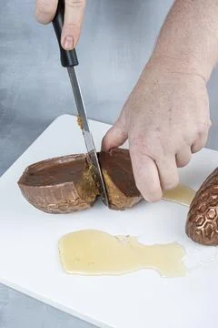 Milk chocolate Easter egg filled with Brazilian honey cake 9. Stock Photos