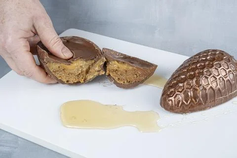 Milk chocolate Easter egg filled with Brazilian honey cake 11. Stock Photos