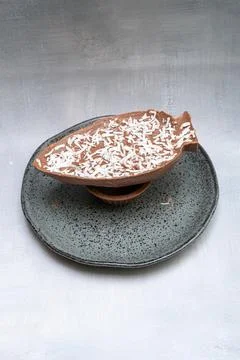Milk chocolate Easter egg with grated coconut vertical. Stock Photos