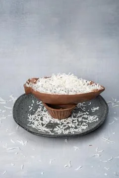 Milk chocolate Easter egg with grated coconut front view vertical. Stock Photos