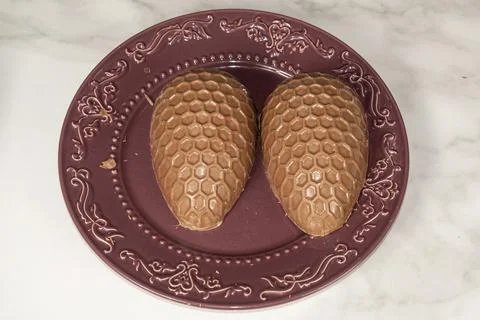 Milk chocolate Easter egg halves with honeycomb texture. Fotos de archivo