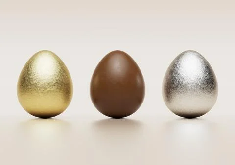 Milk chocolate easter eggs with gold and silver Aluminium foil. Stock Photos