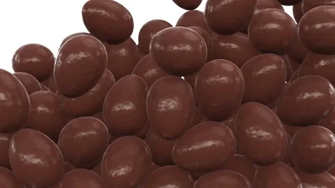 Milk chocolate eggs falling from the top filling up the volume Vídeos de archivo 270404268