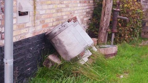 Milk churns (cans) on a row Stock Footage