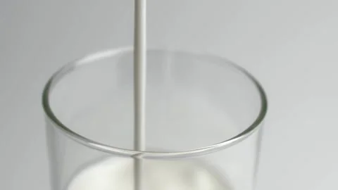 Milk concept drink white background fresh liquid motion isolated drinking Stock Footage 336576892