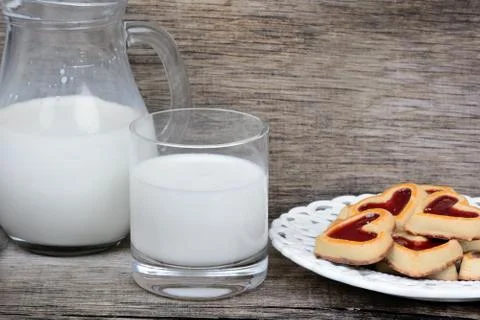 Milk with cookies on table Stock Photos
