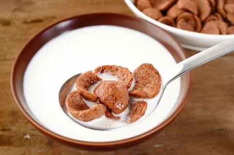 Milk with corn flakes Stock Photos