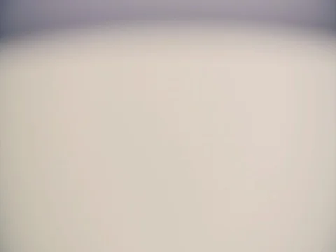 Milk drop drips to liquid white surface 4k slow-motion close-up video Dairy Stock Footage 83102323