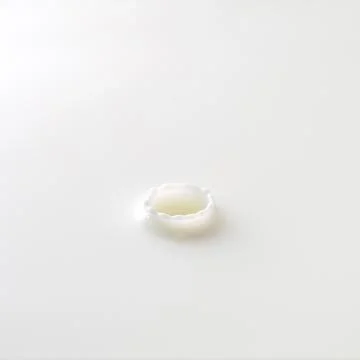 Milk drop with ripples Stock-Fotos