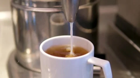 Milk Drop Tea: Splashing Splash in Cup Stock Footage 343658191
