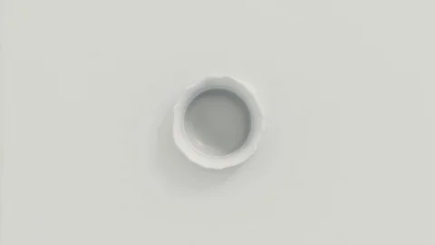 Milk dropping and splashing forming a beautiful crown splash (top view) Stock Footage 85877061