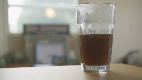 Milk dropping into coffee in slow motion 動画素材 99060478