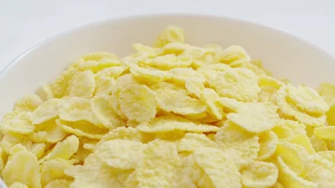 Milk flows into the bowl with cornflakes 動画素材 171887899