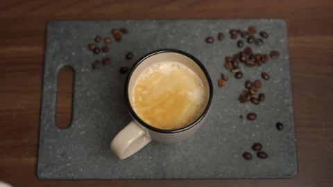 Milk gets poured into a coffee Stock Footage