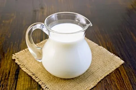 Milk in a glass jar on sacking Stock Photos