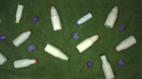 Milk on the grass. Top view. Видео 122587913