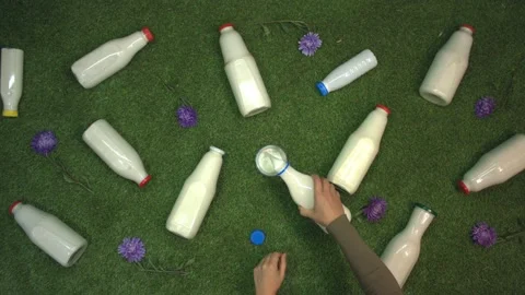 Milk on the grass. Top view. Slow motion 2x. Видео 122588166
